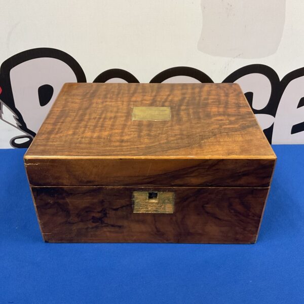 Antique walnut writing slope with keyhole and carrying handle.