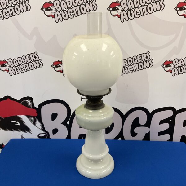 Vintage oil lamp with Cosmos Brenner and frosted glass shade.