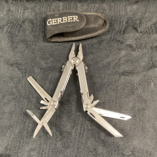 Closed view of a Gerber multitool with pliers and knife blade visible.