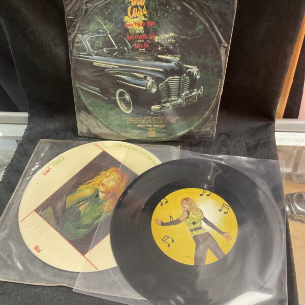 The Cure picture disc vinyl record, featuring band imagery.