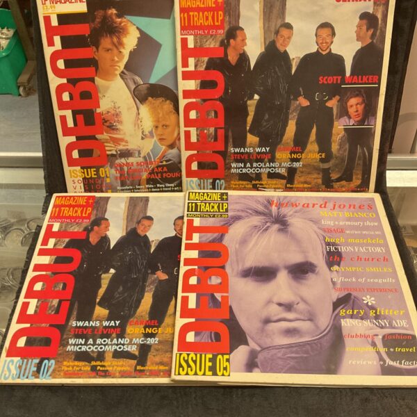 Vintage 1980s Debut magazine collection with vinyl LP record.