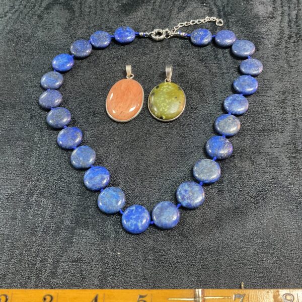 Vibrant lapis lazuli necklace with two jasper pendants.