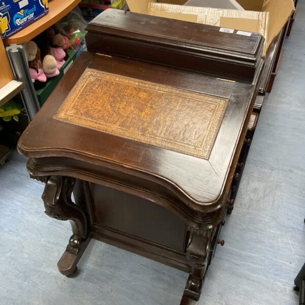 Antique Victorian davenport desk with mahogany finish.
