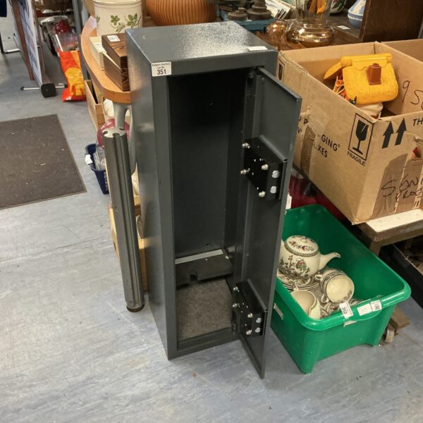 Front view of a used metal gun cabinet for secure storage.