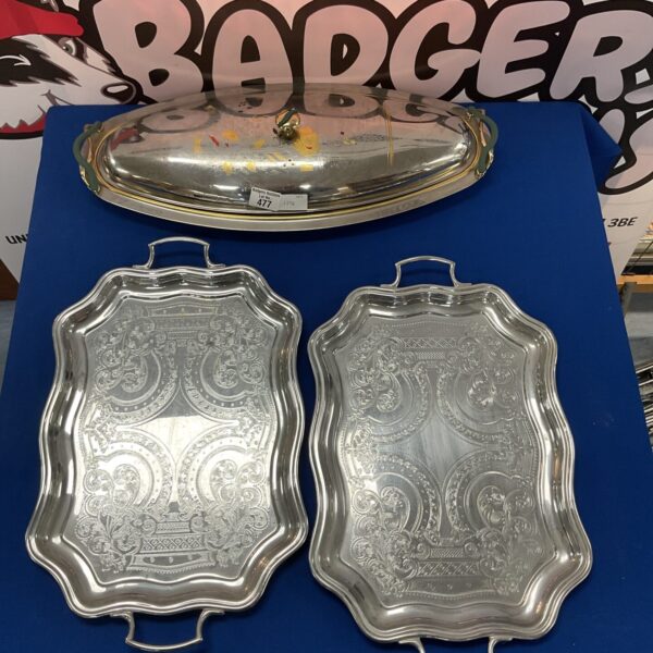 Ornate silver plated serving tray with embossed floral design.