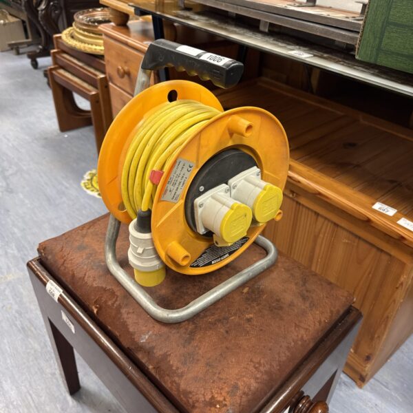 Yellow 110v twin gang extension reel for portable power.