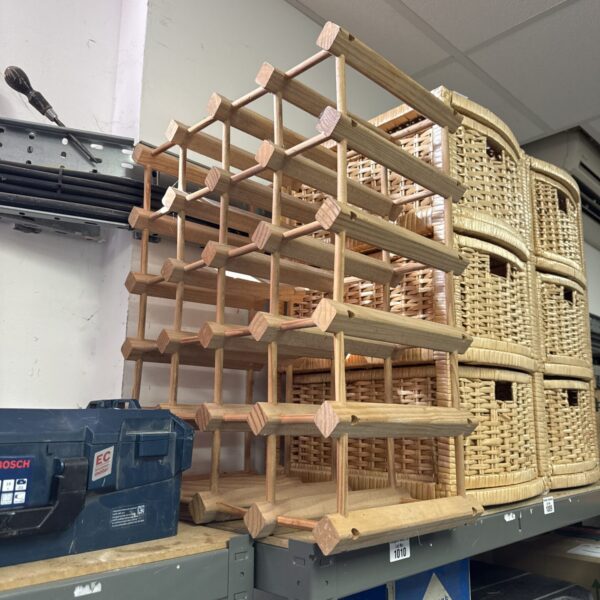 Rustic pine wine bottle rack for home storage and display.