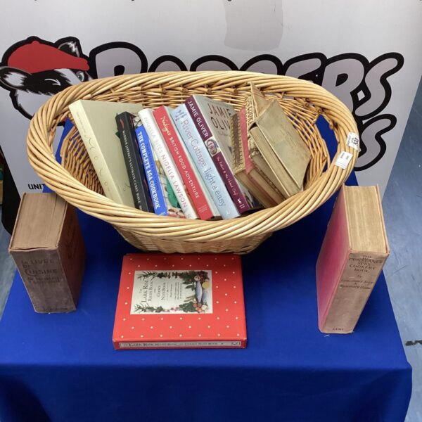 Wicker basket filled with a collection of cook books.