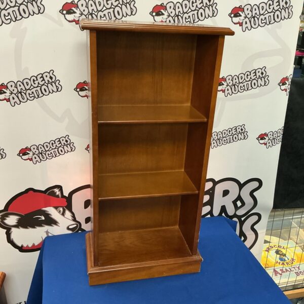 Reproduction small wooden bookcase for books and collectibles.