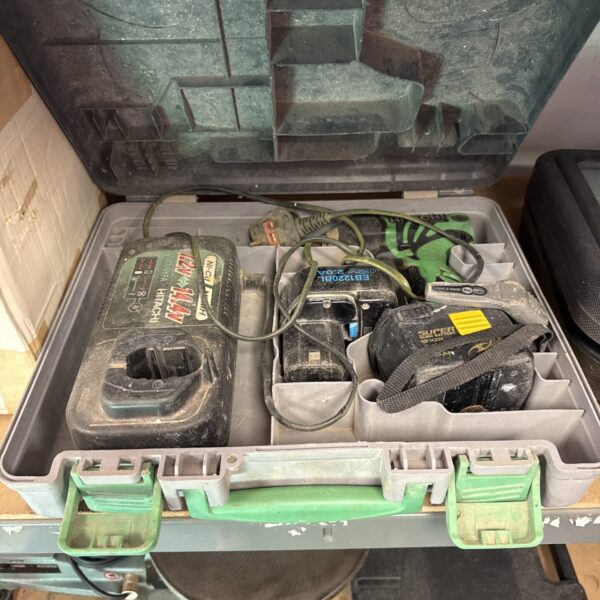 Hitachi cordless impact driver set with battery and charger in case.
