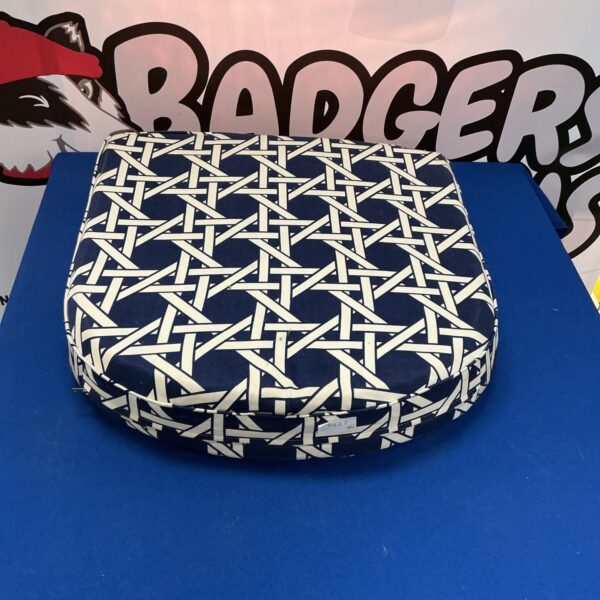 Woven orthopaedic riser cushion for comfortable seating support.