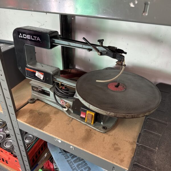 Vintage Delta 12-310 scroll saw for woodworking and detailed crafting.