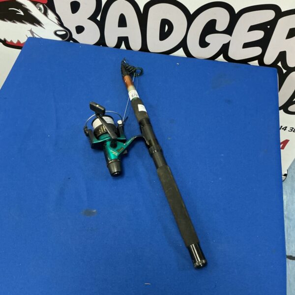 Used telescopic fishing rod with attached reel for portable fishing.