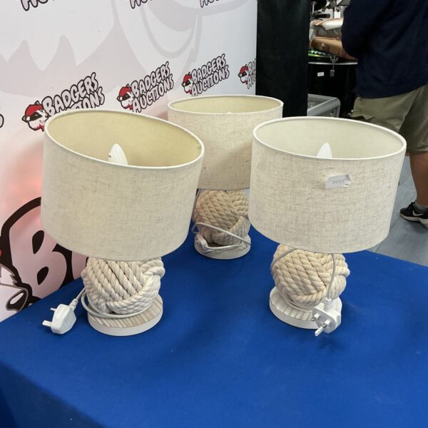 Three vintage rope table lamps with cream shades.