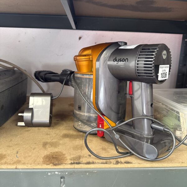 Dyson V8 cordless vacuum cleaner with charger included.
