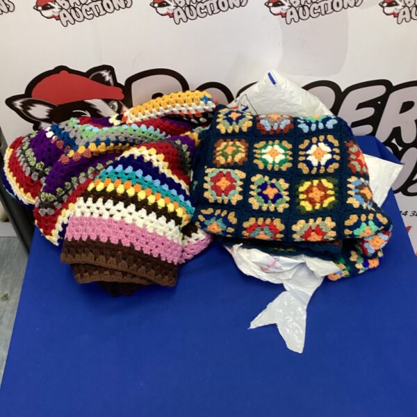 Colorful knitted blankets with a patchwork design, handmade throw.