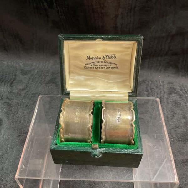Boxed pair of Mappin and Webb hallmarked silver napkin rings.