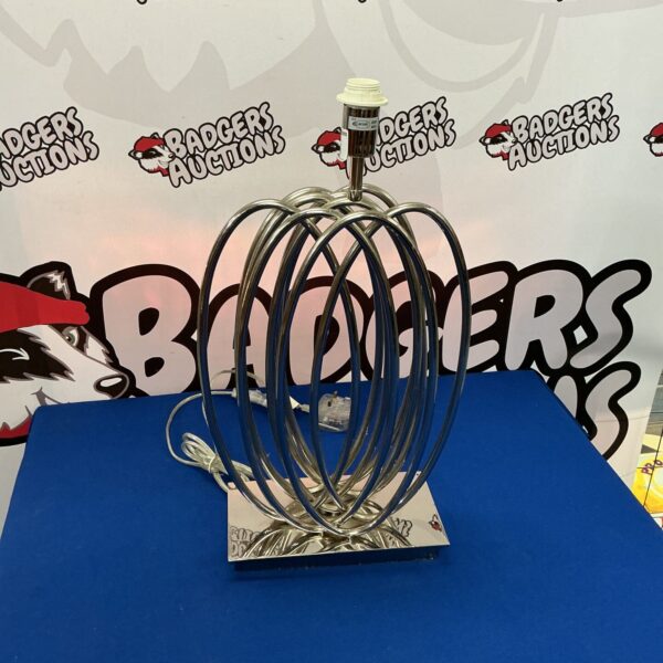 Vintage chrome looped table lamp with a sculptural design.