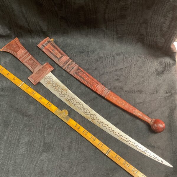Nigerian Tuareg Takouba sword with leather handle and scabbard.