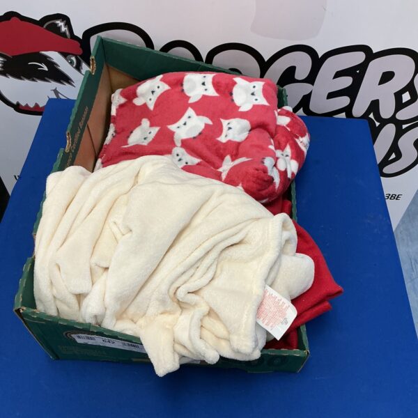 Lot of colourful snuggle blankets for comfort and warmth.