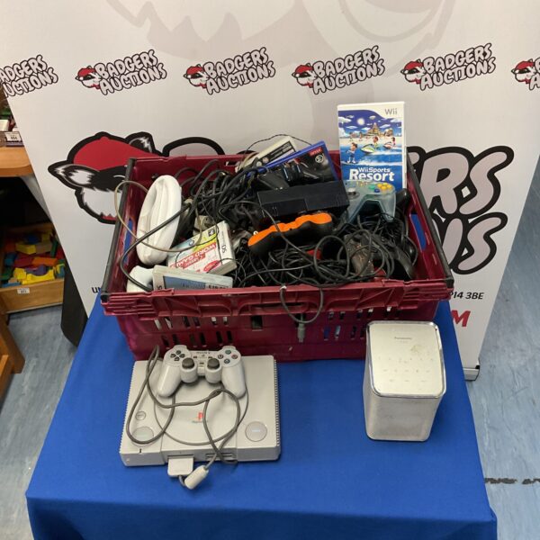 Mixed gaming lot with PlayStation 1 and Nintendo 64 controller.