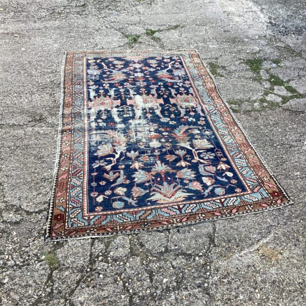 Vintage Aztec rug with intricate geometric patterns and rich colours.