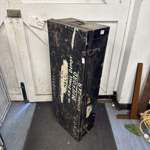 Vintage Royal Navy metal storage trunk with wear.