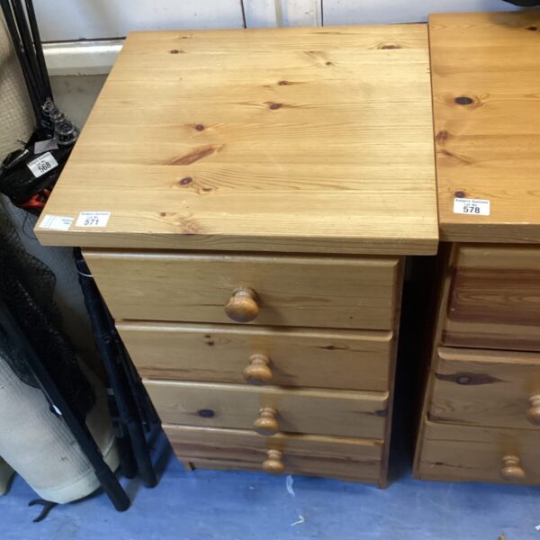 Vintage pine bedside cabinet with four drawers.