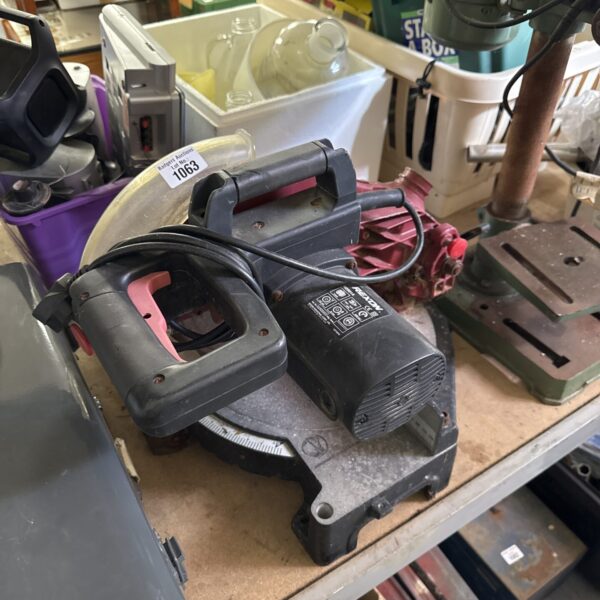 Vintage Rexon M2501A chop saw for metal cutting in workshop setting.
