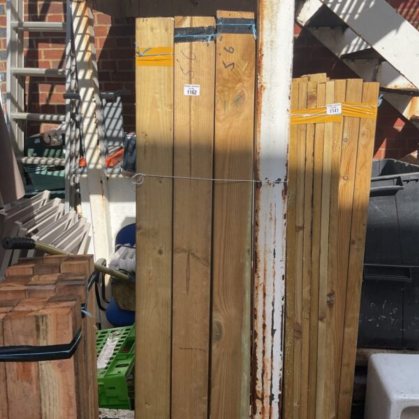 Stack of softwood timber bundles for construction and DIY projects.