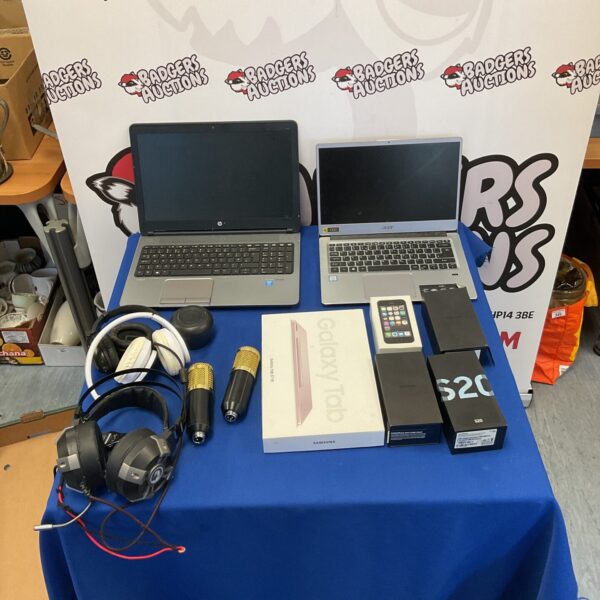 Laptop and phone lot with headphones and empty boxes.