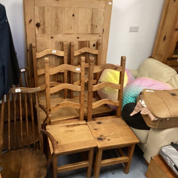 Rustic pine dining table and four chairs set for farmhouse kitchens.