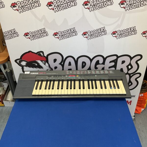 Vintage Yamaha PSR-3 keyboard, a classic 1980s electronic instrument.