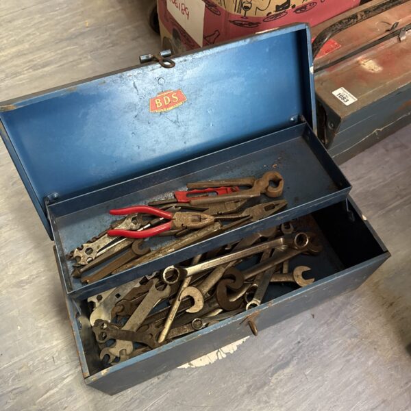 Vintage BDS metal toolbox filled with various workshop tools.