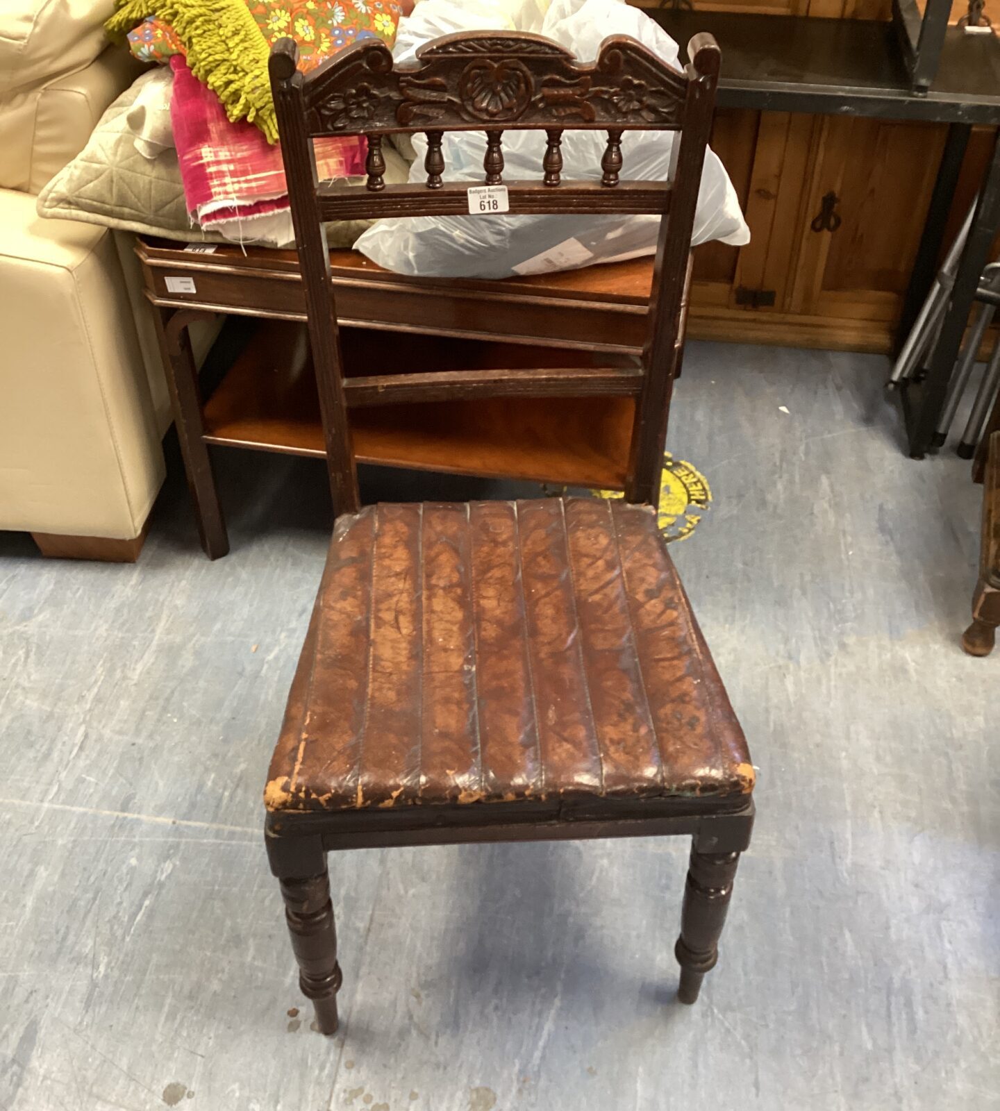 Vintage dark wood dining chair with leather base