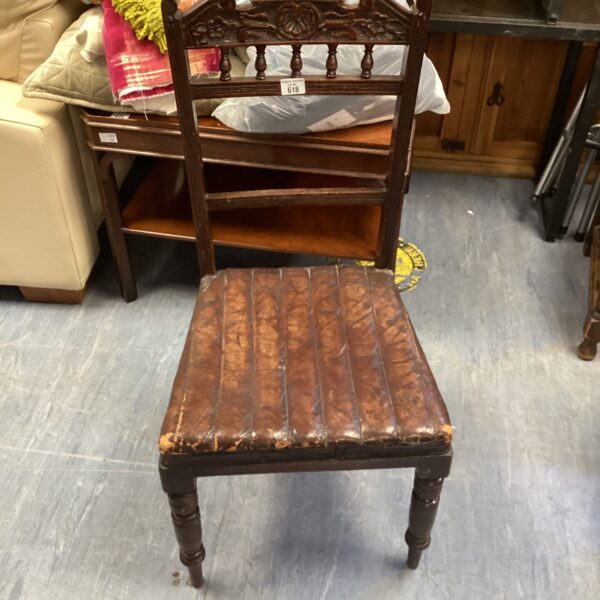 Vintage dark wood dining chair with leather base