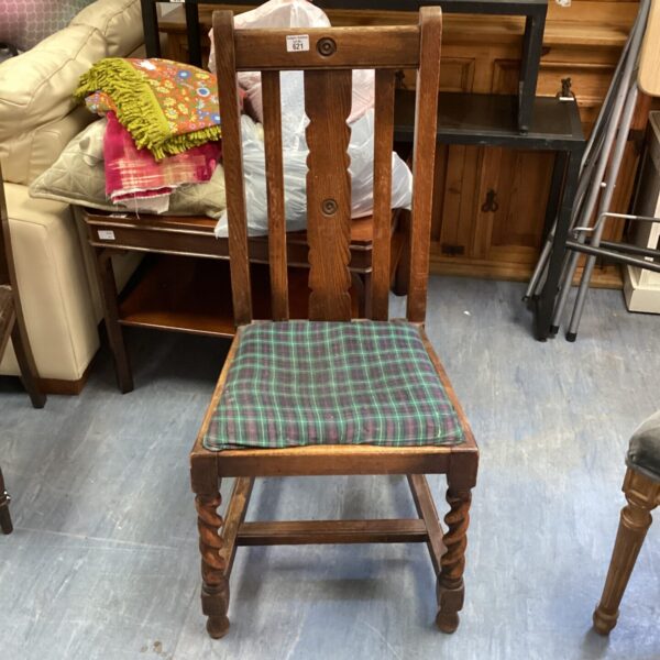 Vintage oak dining chair with spiral legs and patterned seat.
