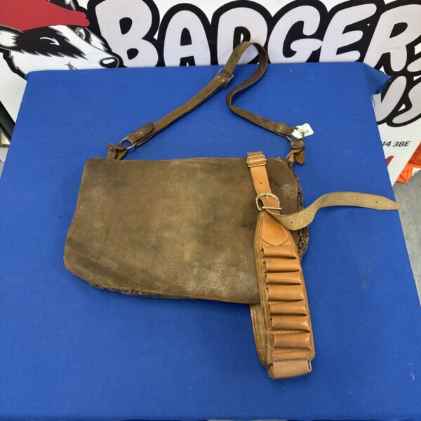 Vintage leather cartridge belt and game bag, antique hunting accessory.