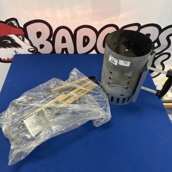 Stainless steel smoker tube and BBQ utensil set for grilling.