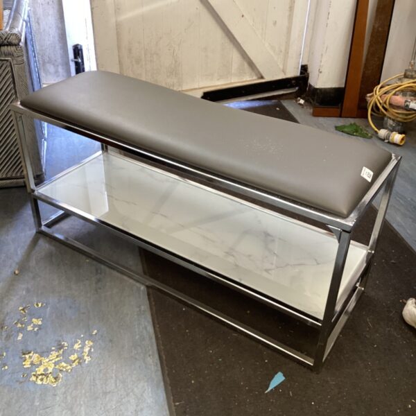 Stylish chrome and leather shoe rack bench for hallway storage.
