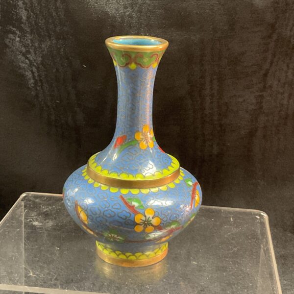 Vibrant Chinese cloisonné bud vase with floral designs.