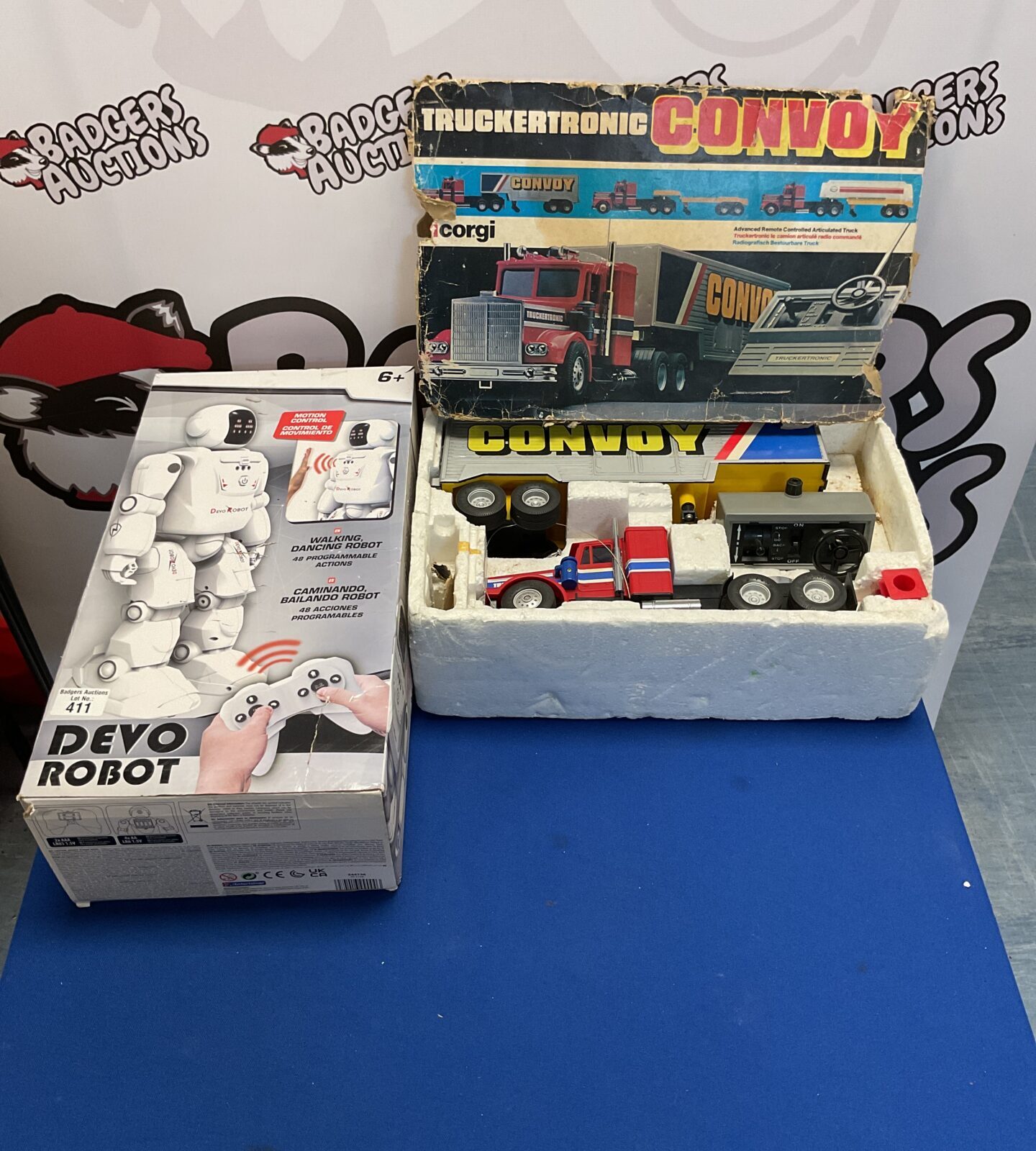 Two boxed toys inc devo robot and vintage convoy truckertronic