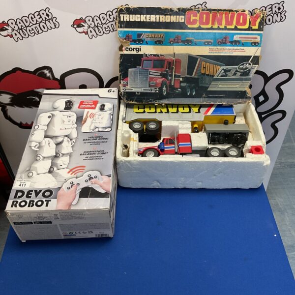 Two boxed toys inc devo robot and vintage convoy truckertronic