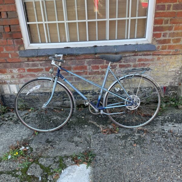 Vintage Raleigh Wisp B4 bicycle in a garden setting.