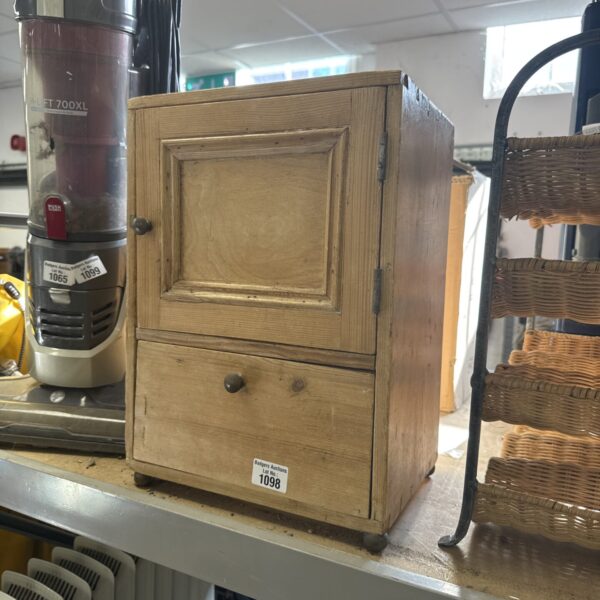 Small vintage pine cabinet with a single door.