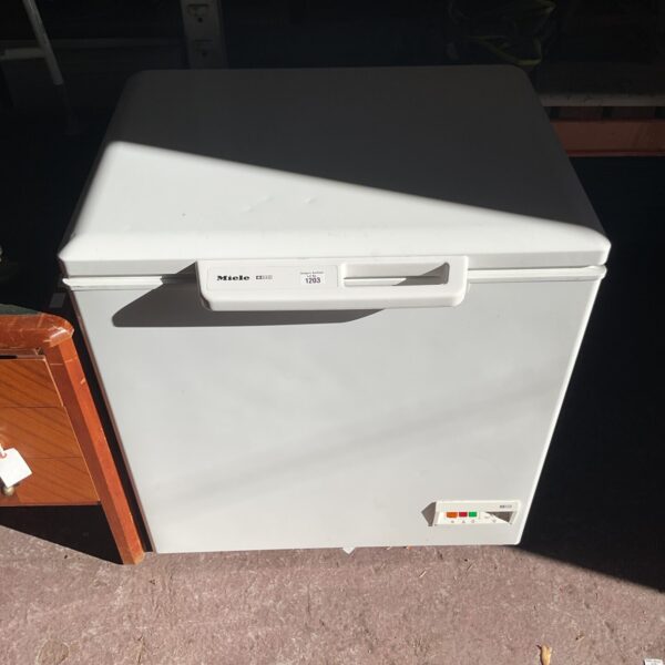 White Miele chest freezer front view, vintage appliance.