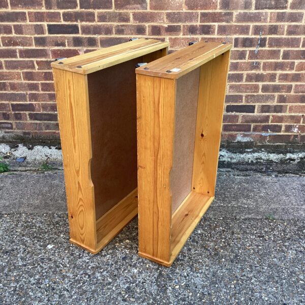 Pair of pine under bed drawers for bedroom storage.