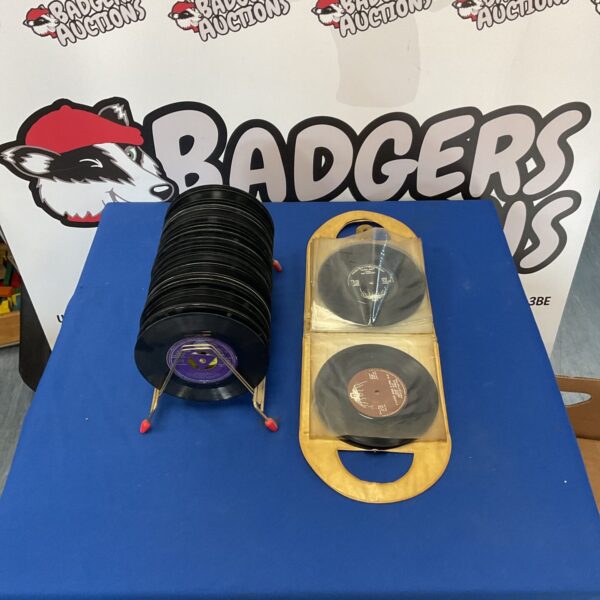 Vintage 7 inch vinyl record collection with stand and bag.