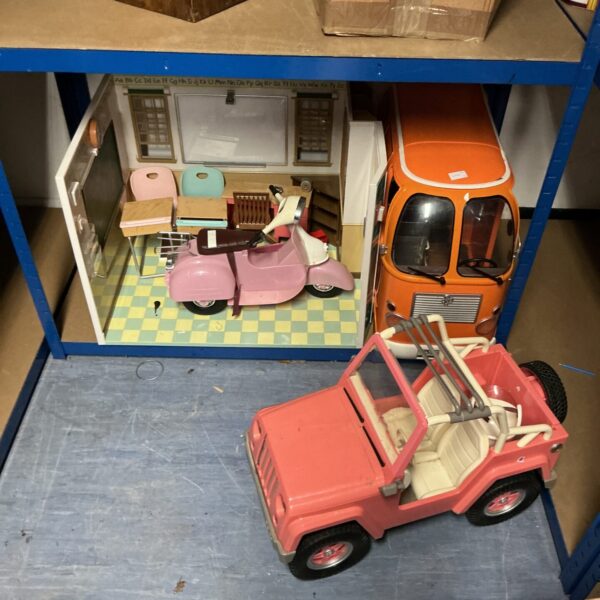 Vintage toy Jeep and camper van lot for collectors.