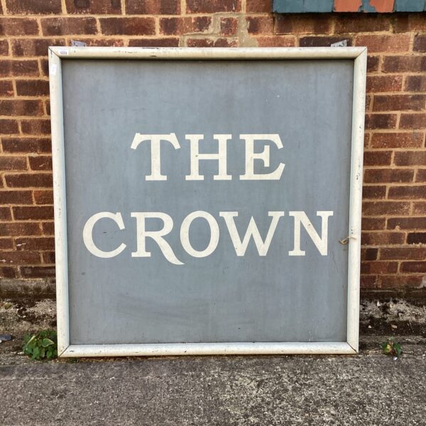 Large vintage pub sign displaying "The Crown" name.